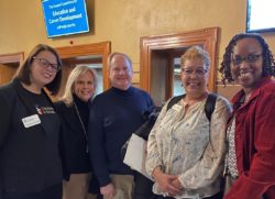 Hadley Moore Vlahogeorge of CIS Indiana and Indiana Community Schools Network Co-Chair, Patricia Weinzapfel of Evansville and Network Co-Chair, Jim Grim of the Network and IUPUI, Shelia Richardson of MSD Lawrence Township, Indianapolis, and LaQuita Maxey of ISTA gather outside the Senate Chamber before the committee hearing, Feb. 24.